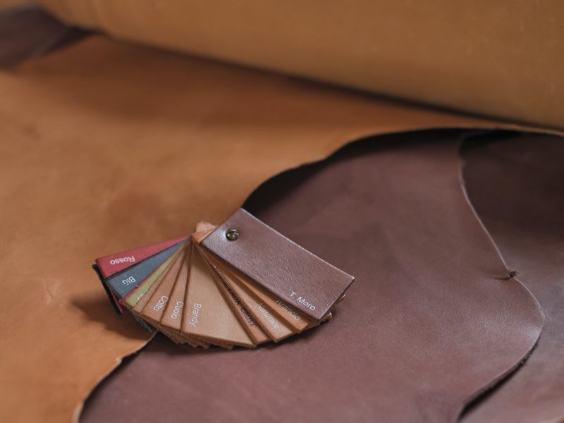 collection of high-quality beige leather swatches in various shades, showcasing their natural